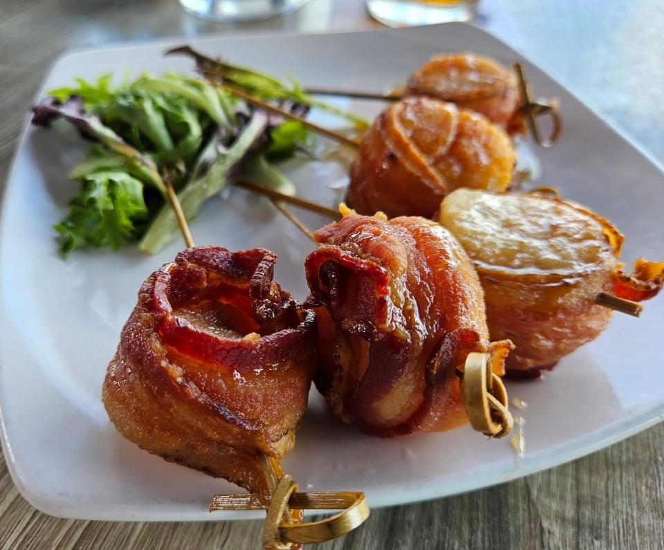Bacon-wrapped scallops at Dry Dock Waterfront Grill on Longboat Key photographed July 9, 2023.