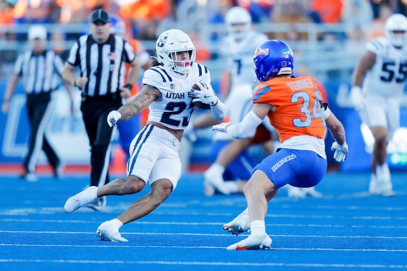 Utah State wide receiver Kyrese White (23) cuts back against Boise State safety Alexander Teubner (34) after a reception in the first half of an NCAA college football game, Saturday, Oct. 5, 2024, in Boise, Idaho. . (AP Photo/Steve Conner) | Steve Conner