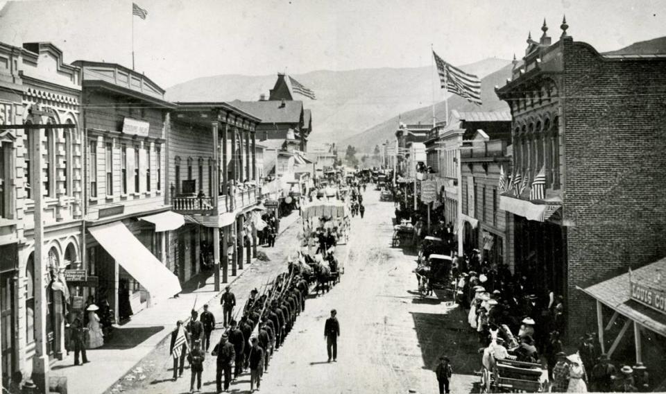 A photo believed to be from 1885 shows a column of Civil War veterans marching down Monterey Street toward Mission San Luis Obispo at the head of a Fourth of July parade.
