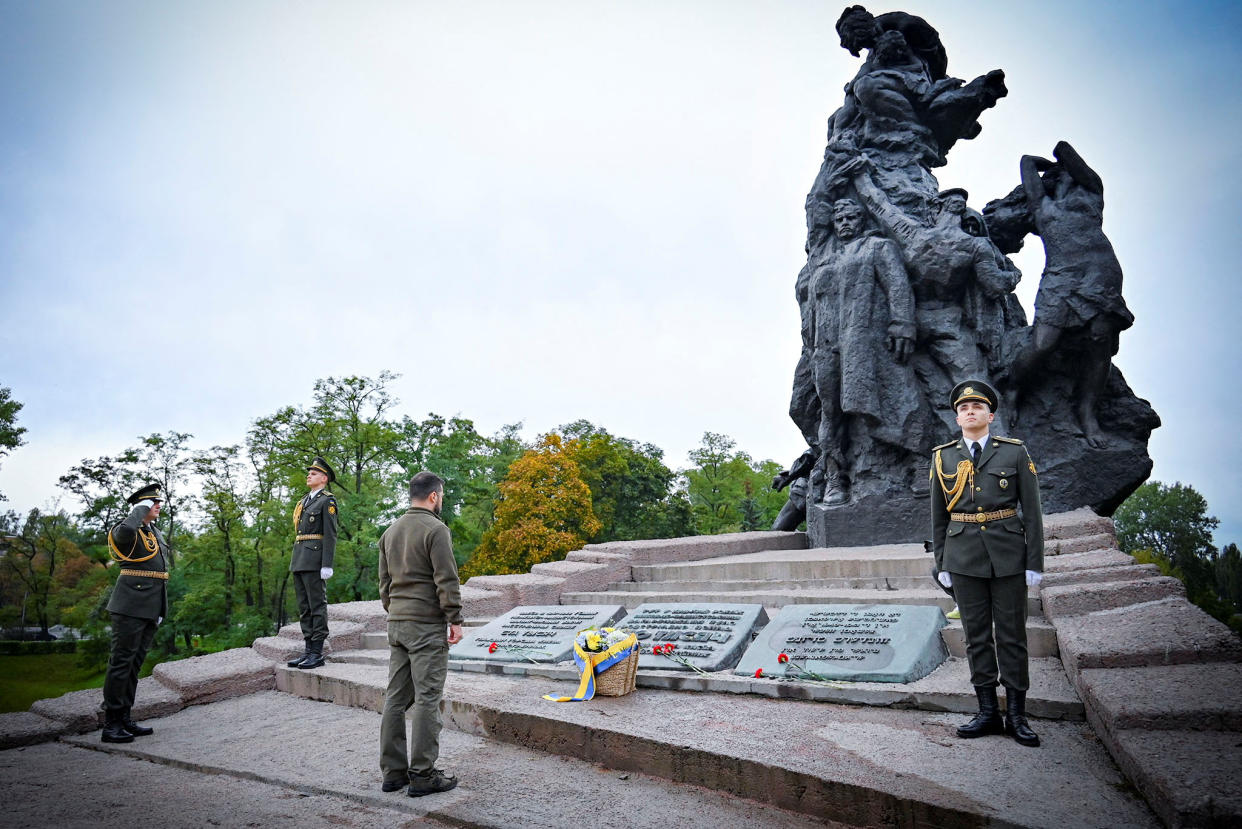 Ukraine's President Volodymyr Zelensky takes part in a commemoration ceremony for the victims of Babi Yar in 2022.