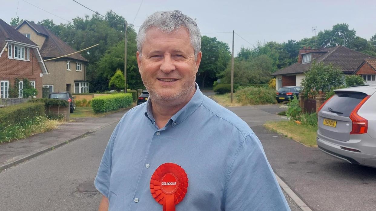 Andy Croy standing in residential street