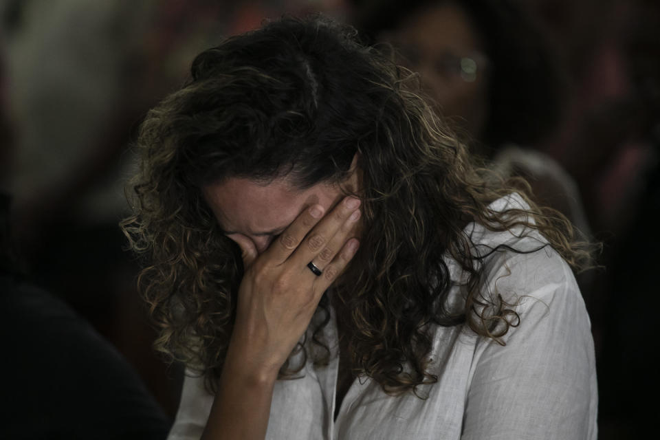 Monica Benicio, widow of of slain councilwoman Marielle Franco, cries during a Mass in honor of Franco and driver Anderson Gomes, marking five years of their murders, still under investigation, in Rio de Janeiro, Brazil, Tuesday, March 14, 2023. (AP Photo/Bruna Prado)