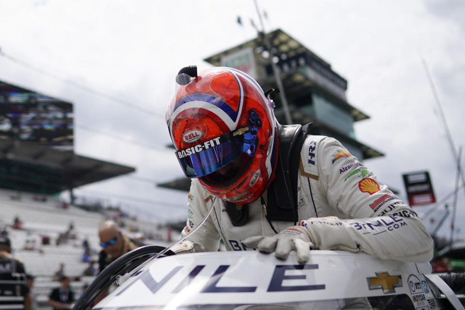 Rinus VeeKay, of The Netherlands, climbs into his car during practice for the IndyCar Grand Prix auto race at Indianapolis Motor Speedway, Friday, May 12, 2023, in Indianapolis. (AP Photo/Darron Cummings)