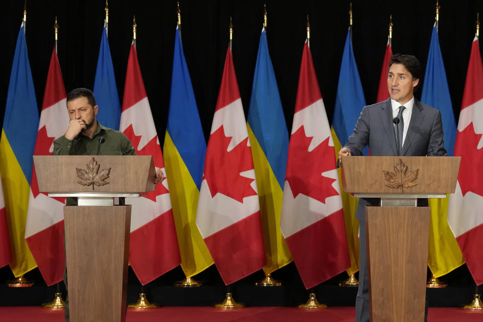 Ukrainian President Volodymyr Zelenskyy, left, and Canada's Prime Minister Justin Trudeau speak to the media at a joint press conference on Parliament Hill in Ottawa on Friday, Sept. 22, 2023. (Adrian Wyld/The Canadian Press via AP)