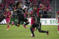 Houston Dynamo's Adalberto Carrasquilla, left, controls the ball as teammate Ibrahim Aliyu (18) defends against St. Louis City's Lucas Bartlett during the first half of an MLS soccer match Saturday, June 3, 2023, in St. Louis. (AP Photo/Jeff Roberson)