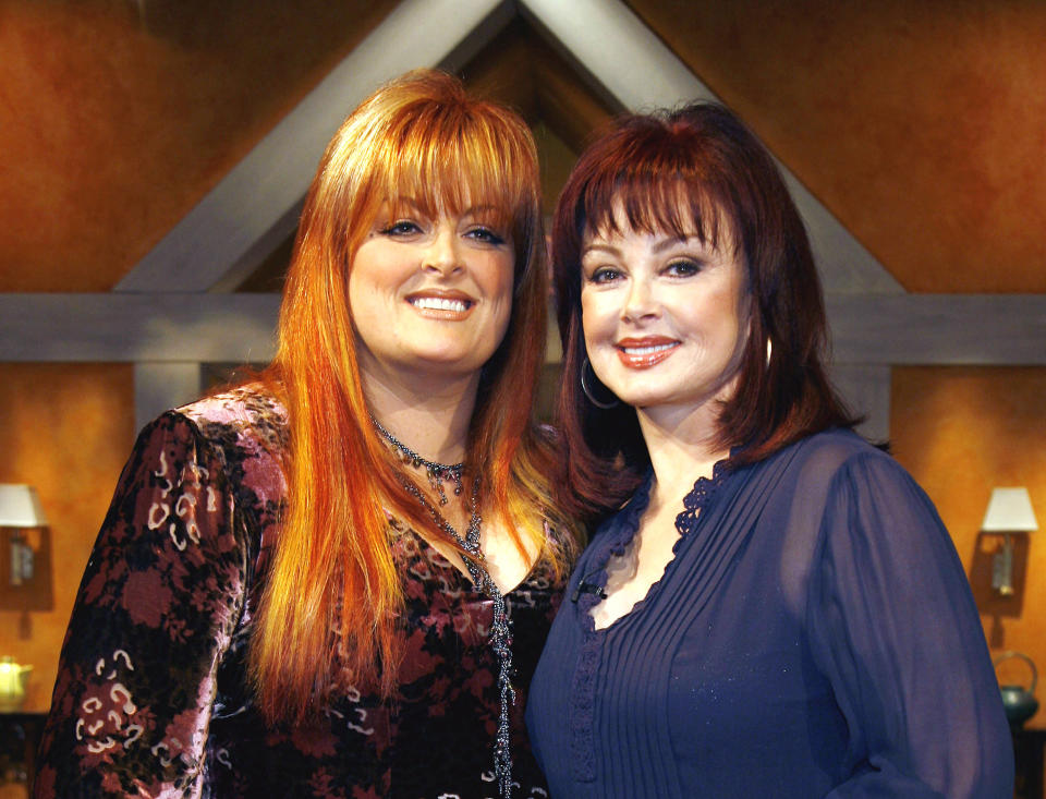 FILE - Wynonna Judd, left and mother Naomi appear on the set before a taping of Naomi Judd's television show, "Naomi New Morning" in New York on Nov. 29, 2006. Fans will have a chance to say goodbye to Naomi Judd, the late matriarch of the Grammy-winning country duo The Judds, on a tour starting Friday. Wynonna Judd will helm the 11-city tour. ( (AP Photo/Rick Maiman, File)