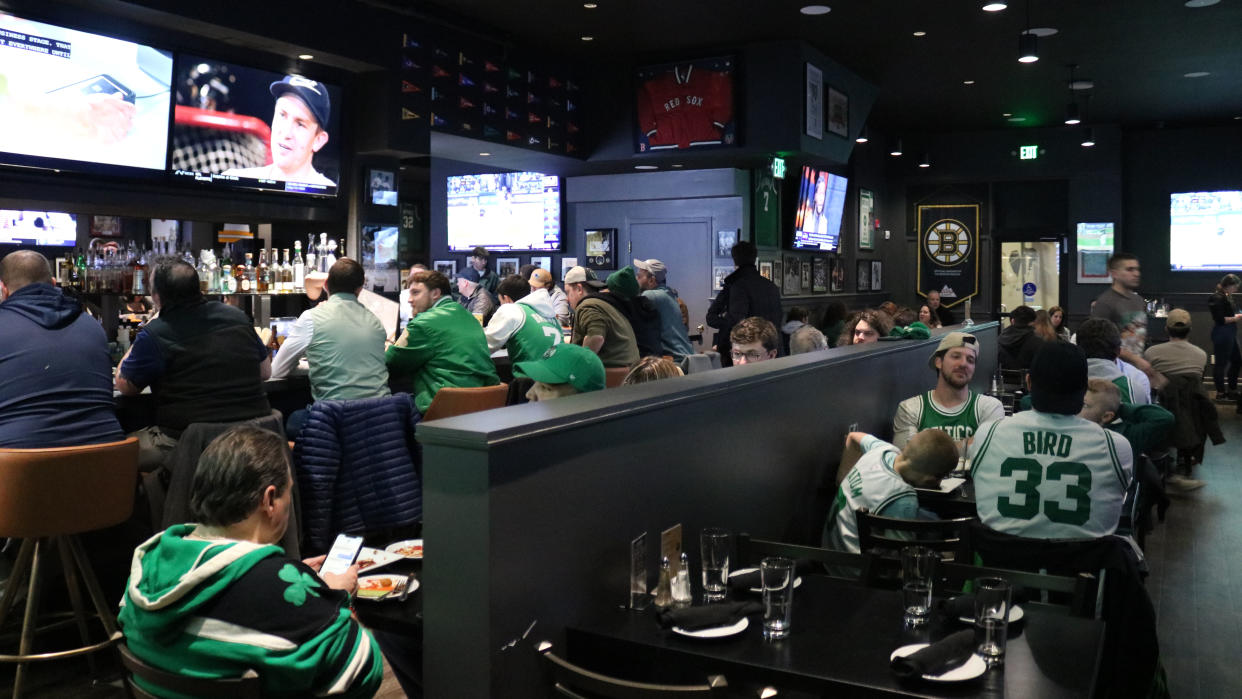  Scores sports bar is hopping with Boston fans watching a bevy of games. . 