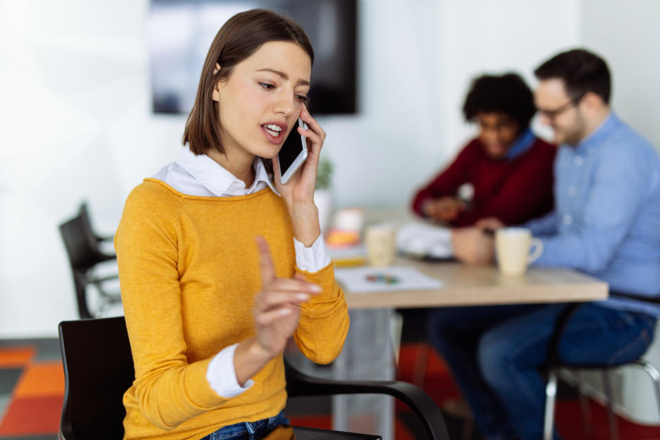 Businessperson talking on mobile phone_GettyImages-1154027287