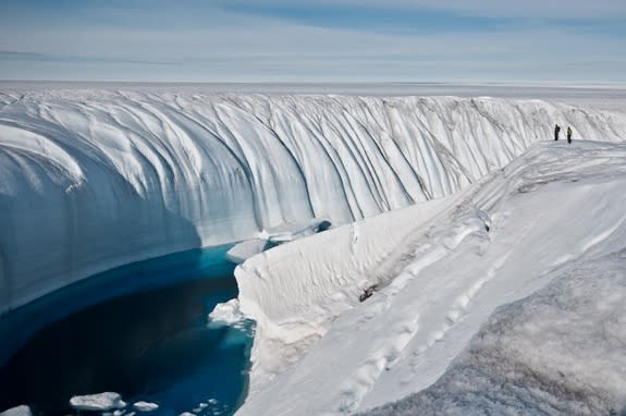 Meltwater creates a 60-foot deep (18.2 meter) canyon in the polar ice sheet.