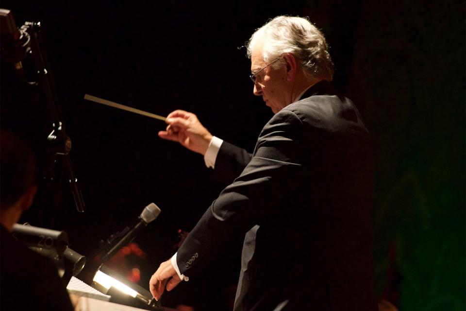 SAN PEDRO, CA - DECEMBER 20: Bruce Broughton serves as guest conductor along with the Golden State Pops Orchestra as they perform their "Holiday POPS Spectacular" at Warner Grand Theatre on December 20, 2014 in San Pedro, California. (Photo by Earl Gibson III/Getty Images)