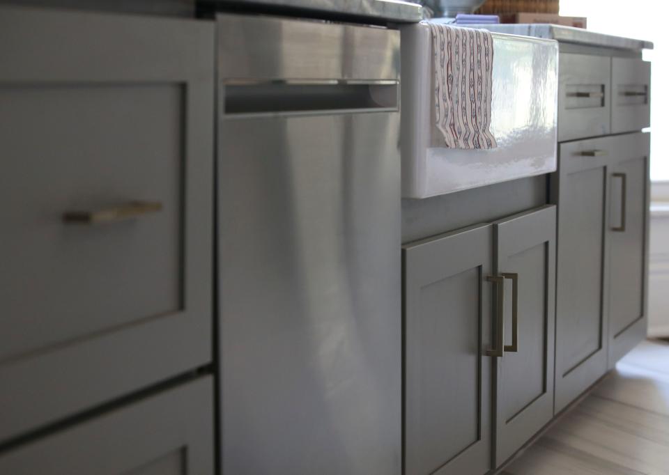 A renovated kitchen done by Dana McMahan in the Beechmont neighborhood of Louisville. The Shaker style cabinets, from Cabinets To Go, feature several pull-out drawers that make it easier to grab things.