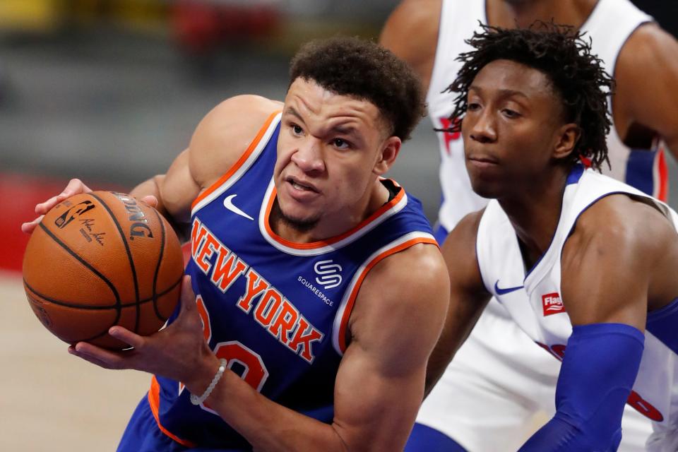 New York Knicks forward Kevin Knox II drives to the basket Dec. 11, 2020, against Detroit Pistons guard Saben Lee during the fourth quarter at Little Caesars Arena in a preseason game.