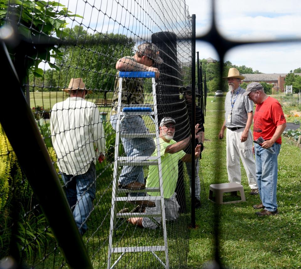 The seven-foot fence, which measured about 150 feet, was installed around St. Mary's Organic Farm garden.