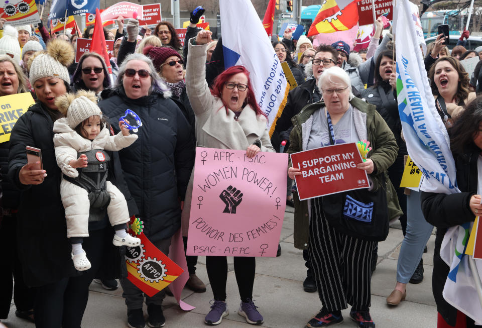 Members of the Public Service Alliance of Canada (PSAC) demonstrate outside the Treasury Board building in Ottawa on Friday, March 31, 2023. THE CANADIAN PRESS/ Patrick Doyle