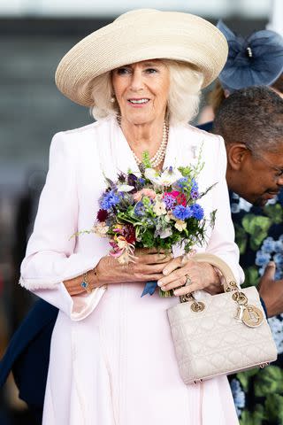 <p>Samir Hussein/WireImage</p> Queen Camilla leaves the Senedd on July 11, 2024 in Cardiff, Wales.