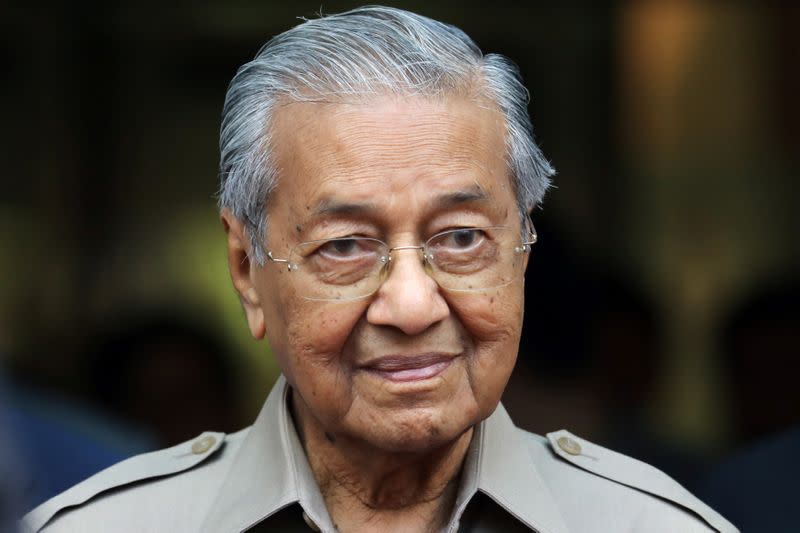 Malaysia's Interim Prime Minister Mahathir Mohamad leaves after an event in Kuala Lumpur