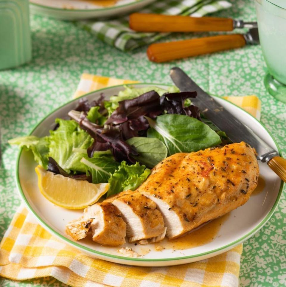 instant pot chicken breast on plate with side salad