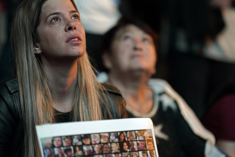 People participate in a show of solidarity with hostages being held in the Gaza Strip, near the Museum of Art in Tel Aviv, Israel, Saturday, Nov. 25, 2023. Egyptian officials said Hamas was preparing to release 14 Israeli hostages Saturday for 42 Palestinian prisoners held by Israel. (AP Photo/ Leo Correa)