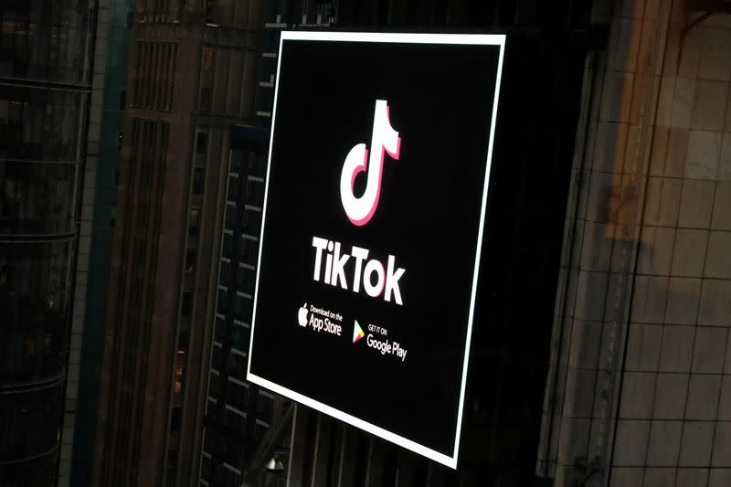 FILE PHOTO: The TikTok logo is seen on a screen over Times Square in New York City