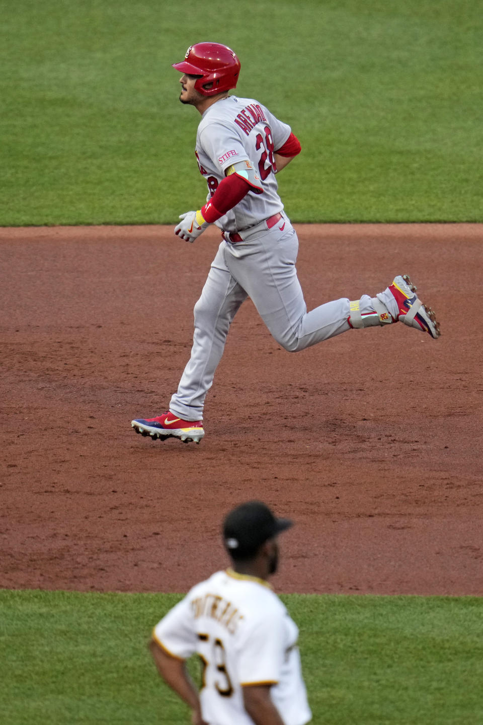 St. Louis Cardinals' Nolan Arenado, top, runs the bases after hitting a two-run home run off Pittsburgh Pirates starting pitcher Roansy Contreras during the third inning of a baseball game in Pittsburgh, Friday, June 2, 2023. (AP Photo/Gene J. Puskar)