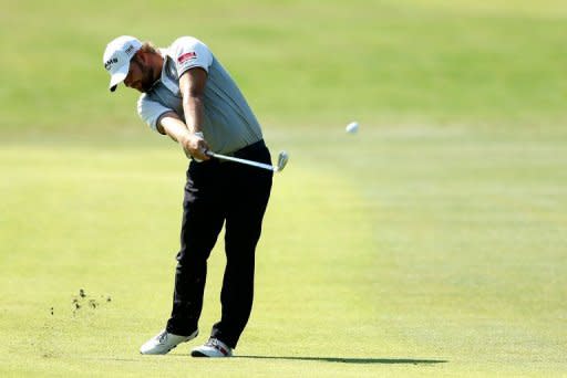 Ryan Moore hits his approach on the 13th hole during the third round of the Tour Championship at East Lake Golf Club in Atlanta, Georgia