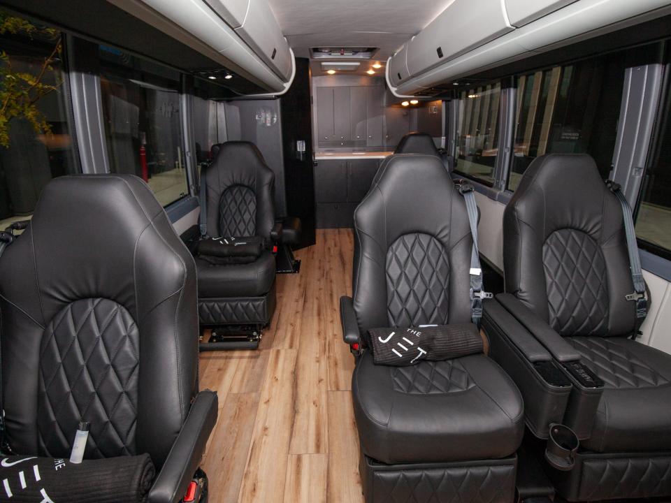 rows of seats inside one of the Jet's buses