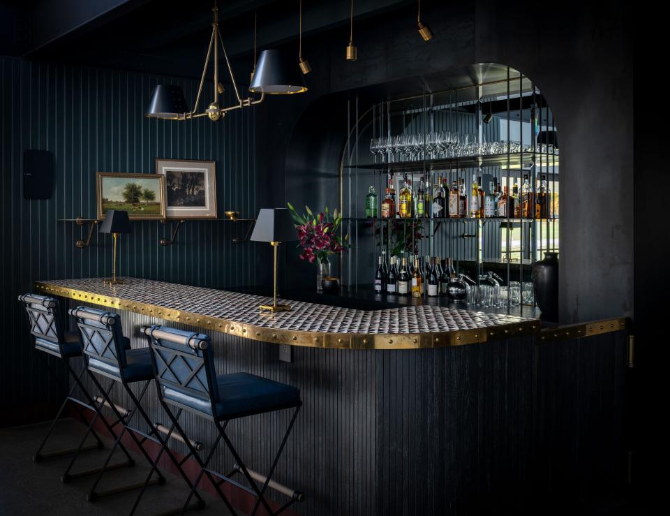 “The bar is an unexpected touch; it creates a darker, more intimate counterpoint to the rest of the nave,” says the designer. “Our clients had a couple of favorite bars in mind, including Le Coucou and the Metrograph Commissary.” The stools, from Thomas Hayes Studio, were upholstered in Moore & Giles leather.