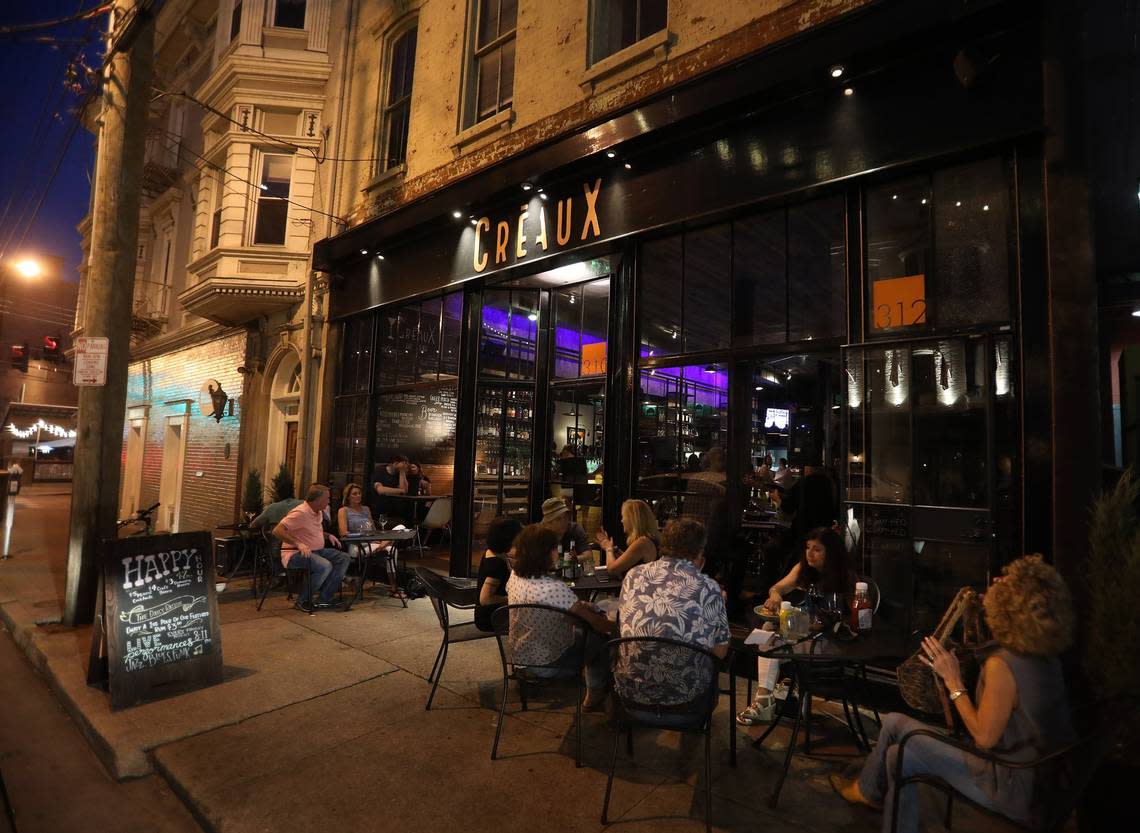 Patrons enjoyed food and cocktails on the sidewalk outside Creaux, located at 310 W. Short St., in downtown Lexington.