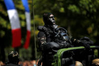 <p>A camouflaged special forces member attends the traditional Bastille day military parade on the Champs-Elysees in Paris, France, July 14, 2017. (Photo: Stephane Mahe/Reuters) </p>