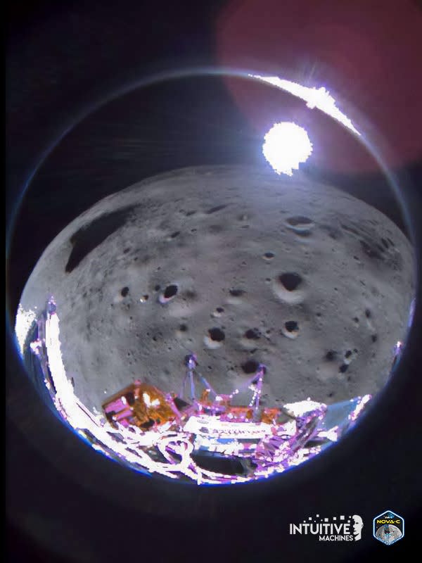 fisheye view of lunar surface with moon lander legs in the foreground