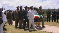 Military personnel carry the coffin of former South African President Nelson Mandela towards his burial site in his ancestral village of Qunuin the Eastern Cape province, 900 km (559 miles) south of Johannesburg, in this still image taken from December 15, 2013 video courtesy of the South Africa Broadcasting Corporation (SABC). REUTERS/SABC via Reuters TV (SOUTH AFRICA - Tags: POLITICS OBITUARY) ATTENTION EDITORS - FOR EDITORIAL USE ONLY. NOT FOR SALE FOR MARKETING OR ADVERTISING CAMPAIGNS. NO SALES. NO ARCHIVES. SOUTH AFRICA OUT. NO COMMERCIAL OR EDITORIAL SALES IN SOUTH AFRICA. THIS PICTURE WAS PROCESSED BY REUTERS TO ENHANCE QUALITY