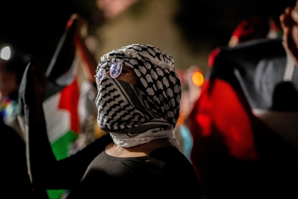 Students and demonstrators protest the war in Gaza after walking out of commencement at the DKR-Texas Memorial Stadium on May 11, 2024 in Austin, Texas.