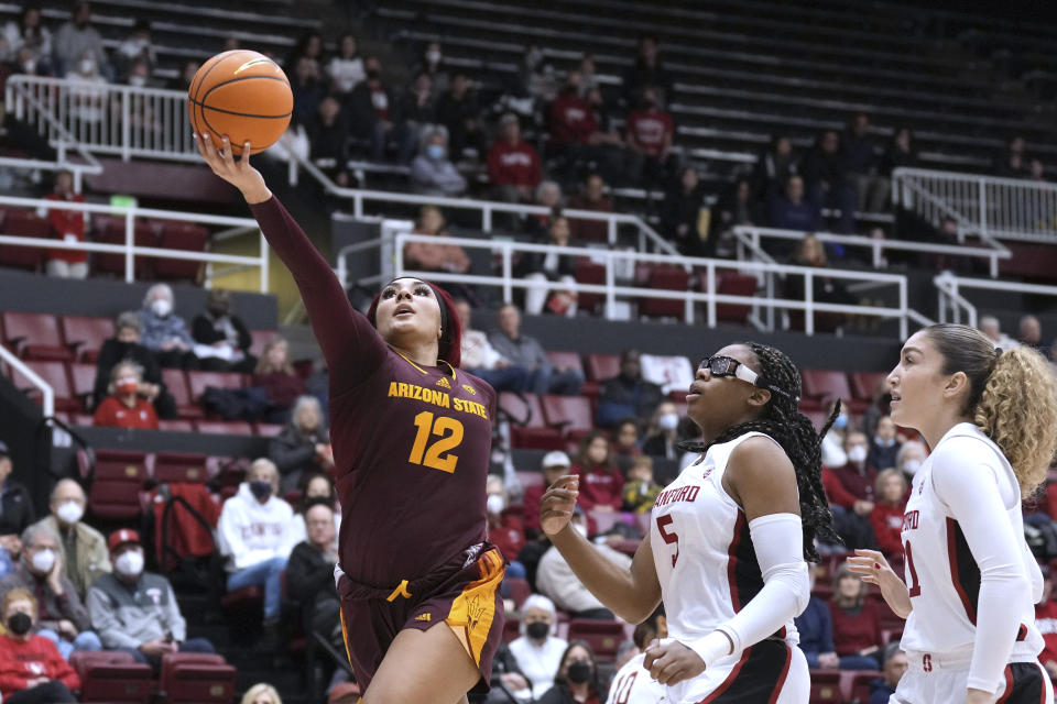 Arizona State guard Treasure Hunt (12) shoots against Stanford forward Francesca Belibi (5) and forward Brooke Demetre, right, during the first half of an NCAA college basketball game Saturday, Dec. 31, 2022, in Stanford, Calif. (AP Photo/Darren Yamashita)