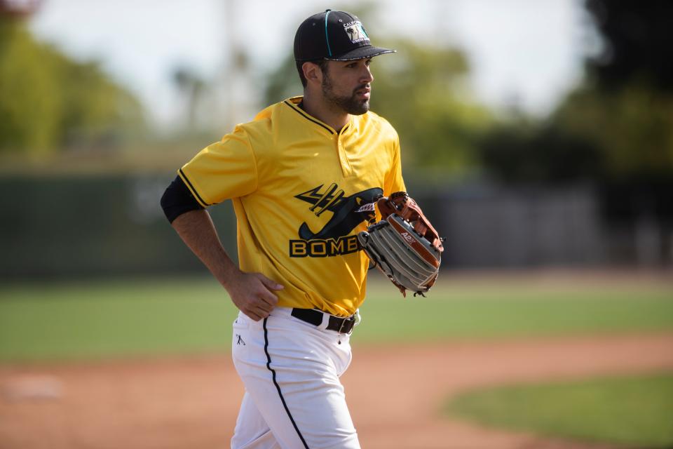 Javier Lopez plays for the British Columbia Bombers in the California Winter League. In this photo he is seeing playing a game against the Palm Springs Power team in Palm Springs. His father played in Major League Baseball. 