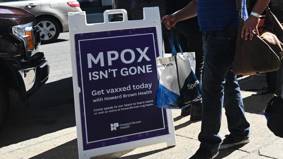 PHOTO: People walk past the Howard Brown Health mpox vaccine mobile station, May 26, 2023, in Chicago. (Joshua Lott/The Washington Post via Getty Images)