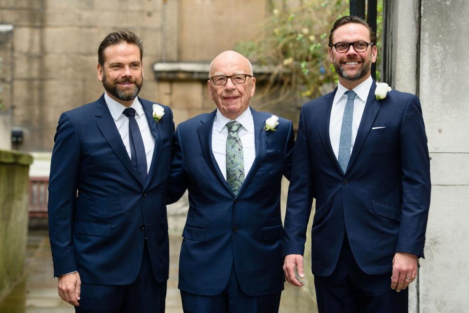 Murdoch with his two sons, Lachlan (left) and James (right) (AFP via Getty Images)