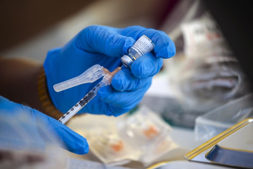 Los Angeles, CA - July 16: Mothers In Action hosts a mobile COVID-19 vaccine clinic, in collaboration L.A. County Department of Public Health at Mothers in Action on Friday, July 16, 2021 in Los Angeles, CA. (Irfan Khan / Los Angeles Times)