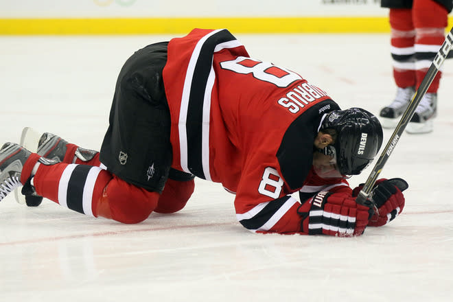  Dainius Zubrus #8 Of The New Jersey Devils Kneels Getty Images