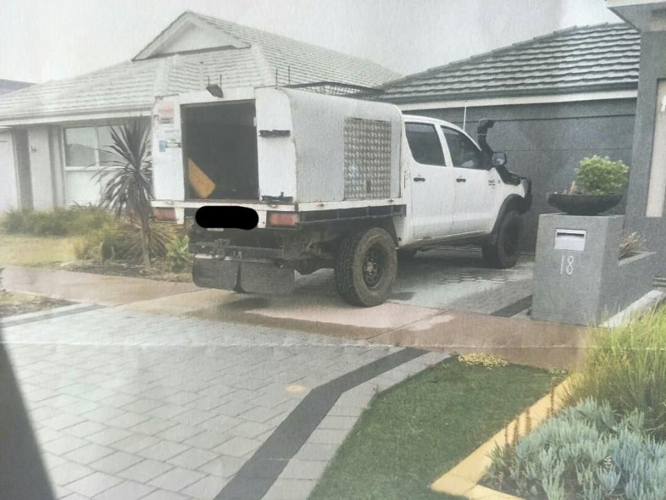 Pictured is a ute parked in a Perth driveway with the tray slightly hanging over the footpath.