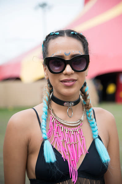 <p>Obviously braids were a huge hit, but trendsetters were adding a unique twist by mixing colour in with the plaits. We predict turquoise ends are going to be making waves this summer. <i>[Photo: Getty]</i> </p>