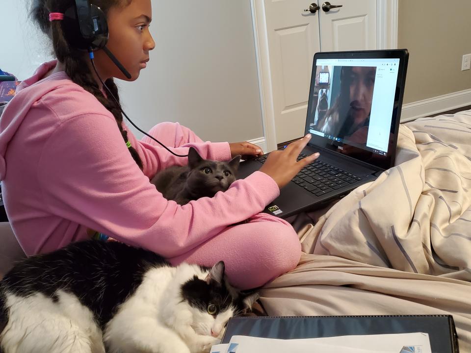 Haley Sarden, 11, on her laptop. Her mom, Judy, a homeschool expert, says learning from home isn't perfect and parents need to give themselves grace. [Photo: Judy Sarden]