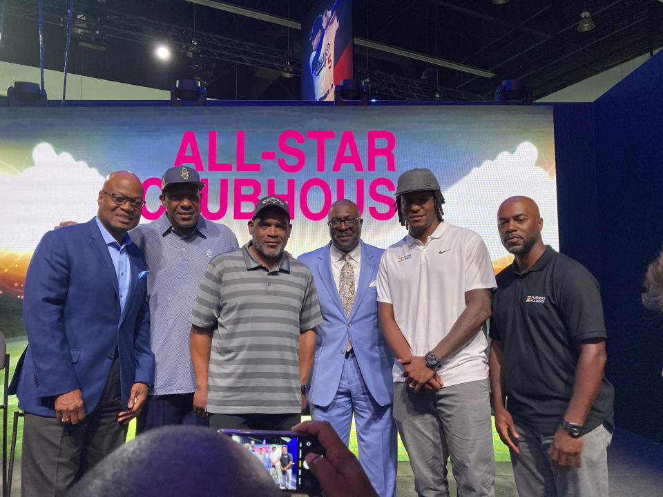 From left, Seattle Mariners announcer Dave Sims, former All-Stars Andre Dawson and Tim Raines, Negro Leagues Museum president Bob Kendrick, and retired All-Stars Edwin Jackson and Jimmy Rollins chat after participating in a panel, Monday, July 18. 2022, on the life and legacy of Jackie Robinson in Los Angeles. (AP Photo/ Beth Harris)