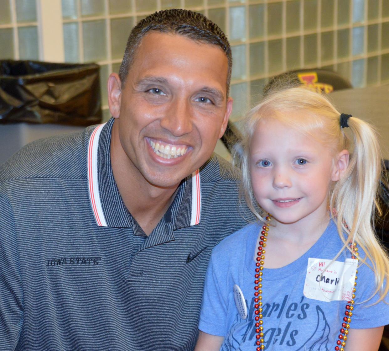 Iowa State head football coach Matt Campbell poses with Charlie Hugunin during the Charlie's Angels Lunch with Coach Matt Campbell fundraiser in 2019. The event, which raises money for cystic fibrosis research, is being held this year on Tuesday, July 19.