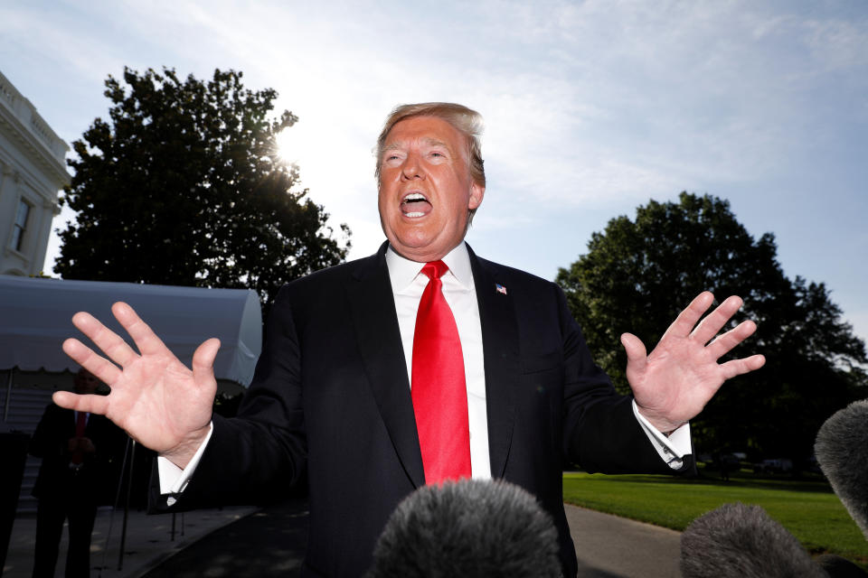 President Trump speaks to reporters on the South Lawn of the White House on Thursday. (Kevin Lamarque/Reuters)