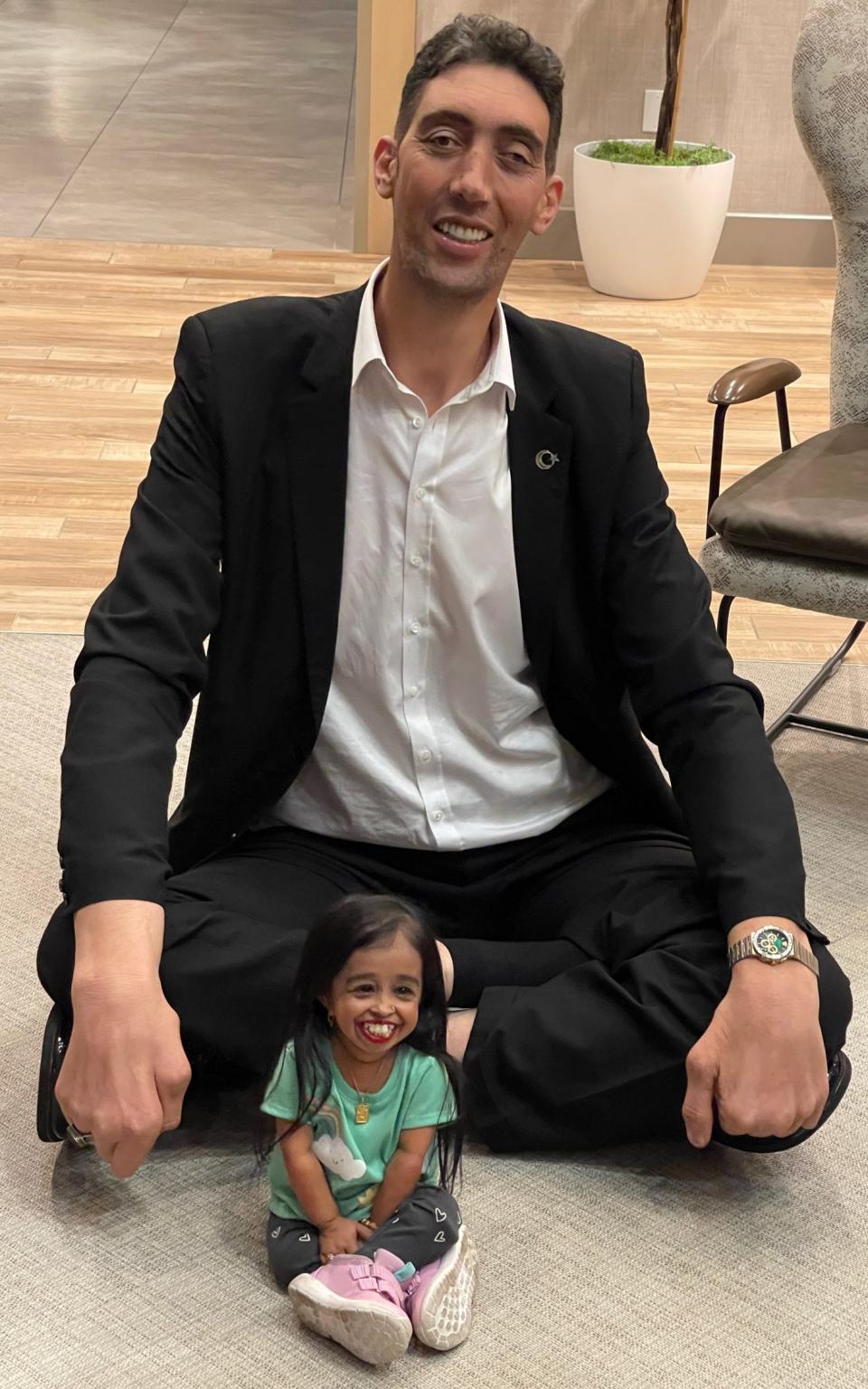 World's tallest living man Sultan Kosen, who is 251 cm (8 ft 2.82) meets Jyoti Amge, the shortest woman in the world, with a height of 62.8 centimetres in Irvine, California, United States on February 19, 2024.