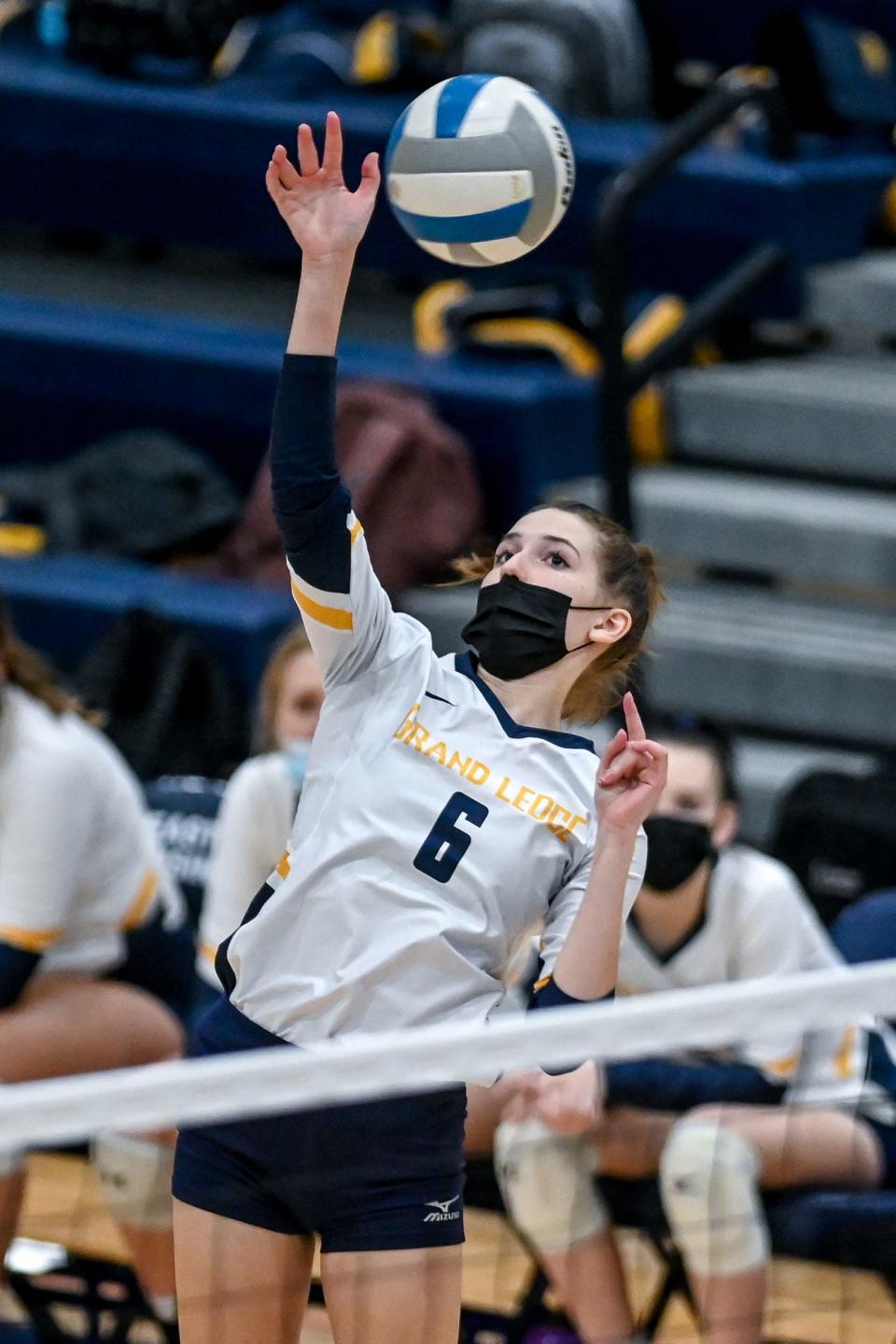 Grand Ledge's Kylie Goodman hits the ball during the first set in the game against DeWitt on Thursday, Nov. 4, 2021, at East Lansing High School.