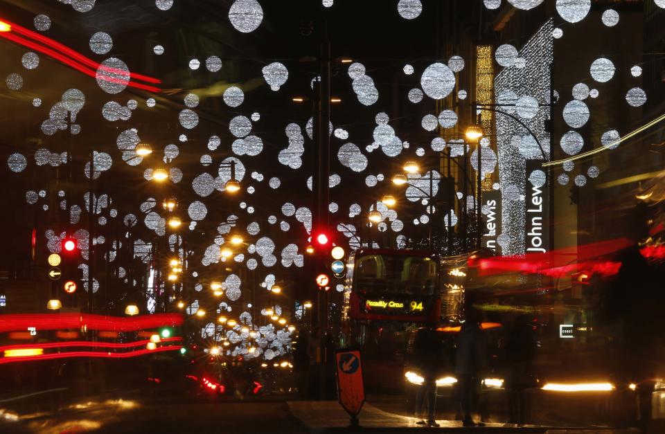 Traffic moves along under the Oxford Street Christmas lights after they were switched on in central London