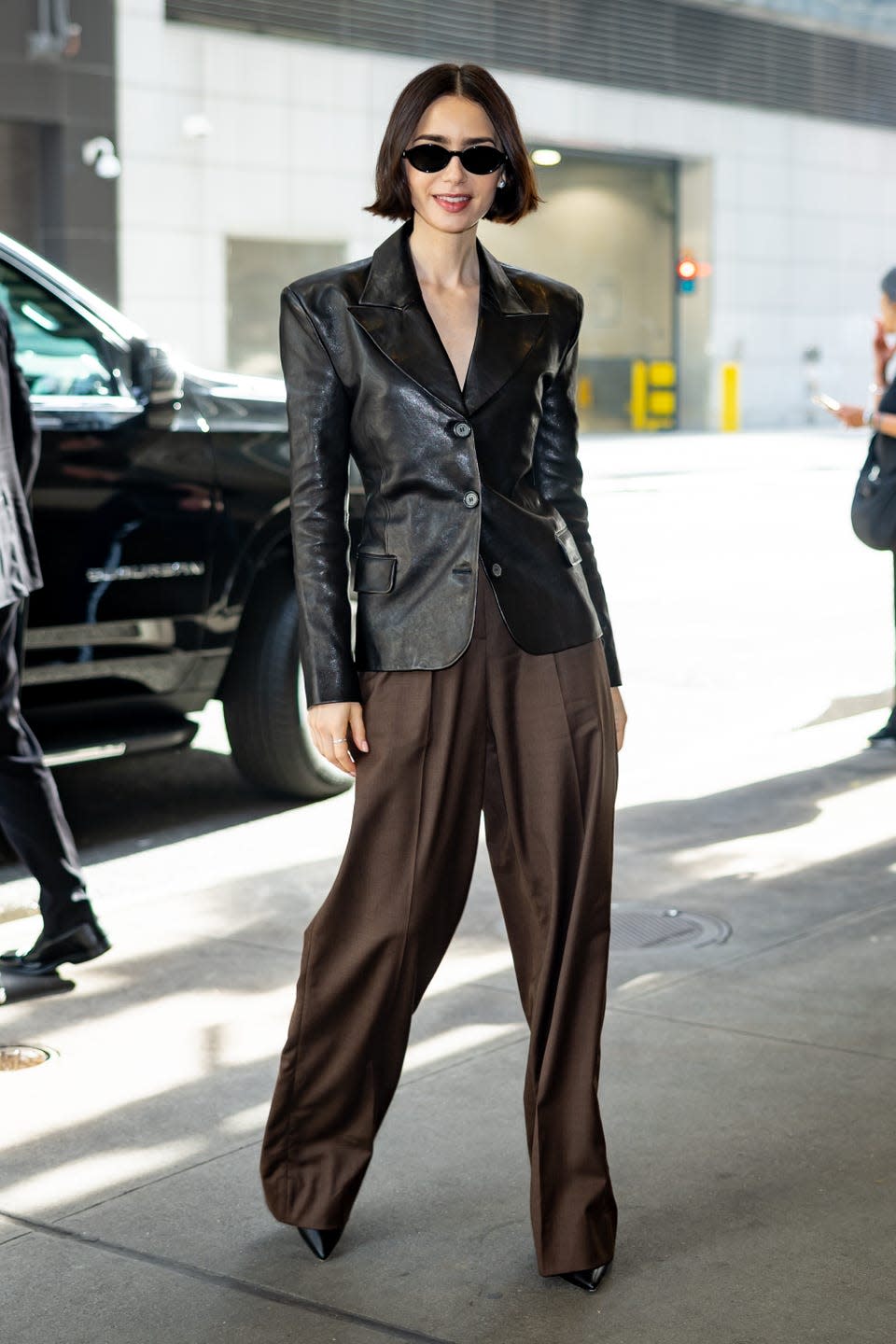 lily collins in black leather blazer in new york city