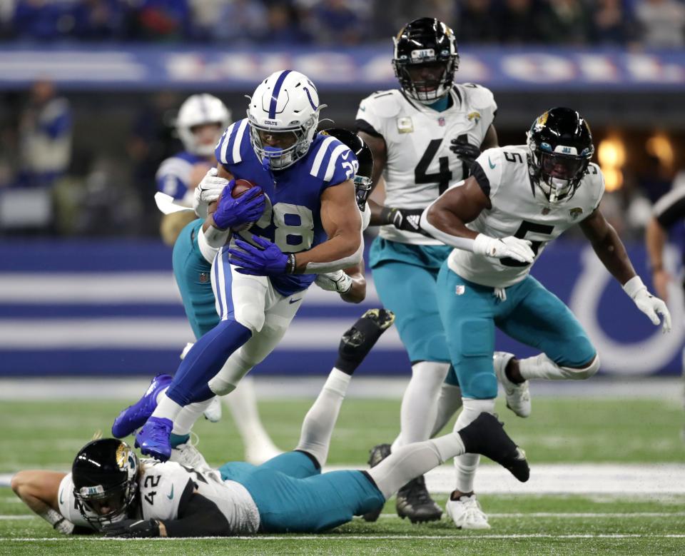 Indianapolis Colts running back Jonathan Taylor (28) rushes the ball Sunday, Nov. 14, 2021, during a game against the Jacksonville Jaguars at Lucas Oil Stadium in Indianapolis.