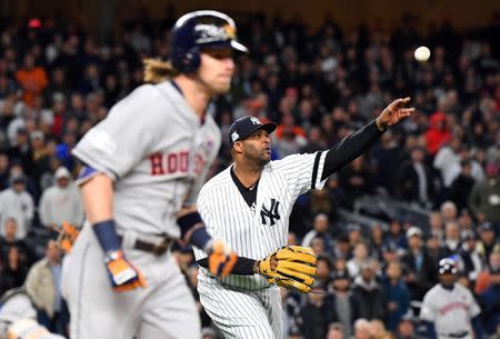 Oct 16, 2017; Bronx, NY, USA; New York Yankees starting pitcher CC Sabathia (52) throws to first base for an out during the sixth inning against the Houston Astros during game three of the 2017 ALCS playoff baseball series at Yankee Stadium. Mandatory Credit: Robert Deutsch-USA TODAY Sports